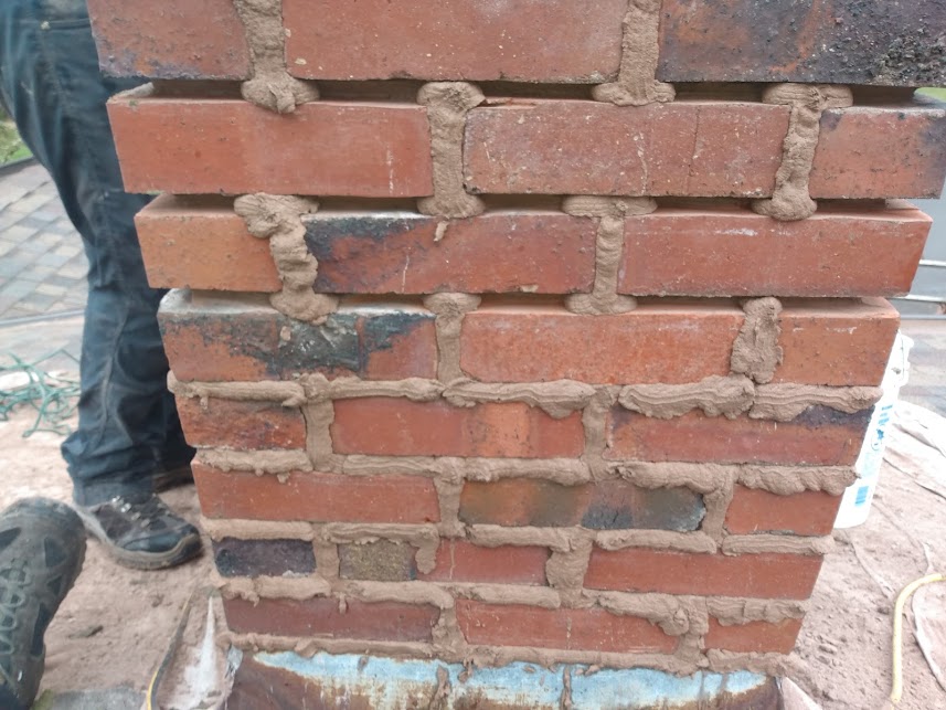 Close-up of uneven brickwork in construction.